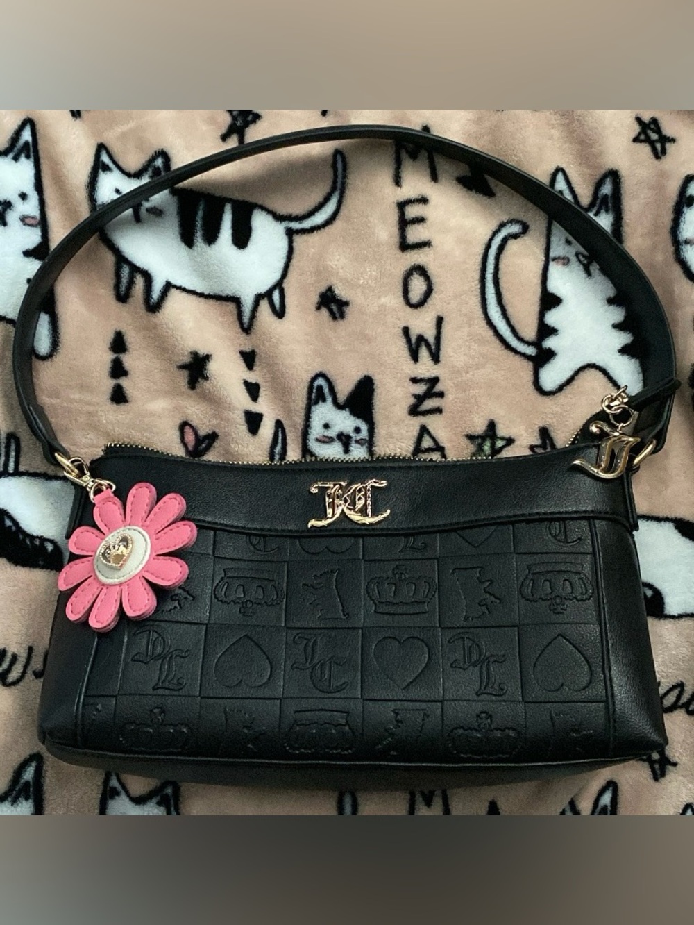 Juicy Couture black shoulder purse with gold hardware.